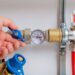 How Do Technicians Diagnose Pressure Fluctuations in Multi-Fixture Plumbing Systems?